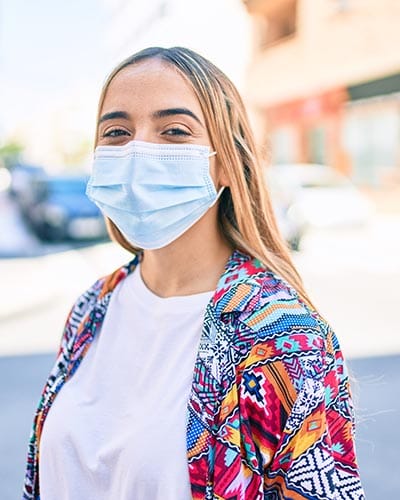 woman in mask thinking about health and safety